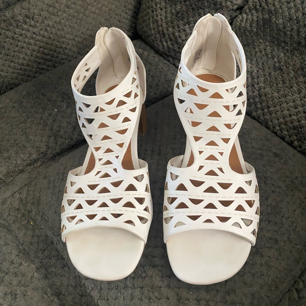Bare traps white sandals with a block heel.